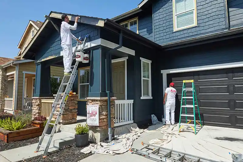 JLM Painting crew working on a residential exterior